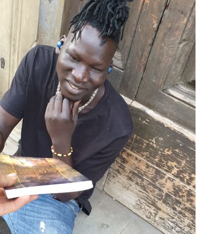 Man receiving a missionary book